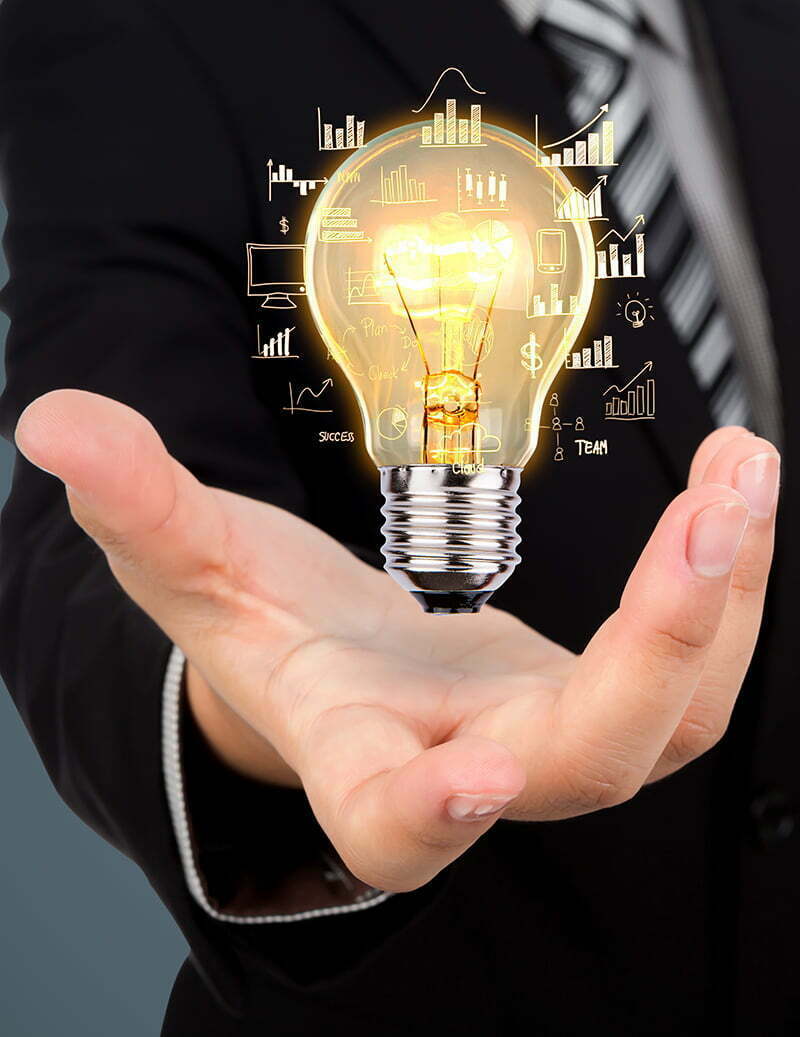 Business man holding light bulb